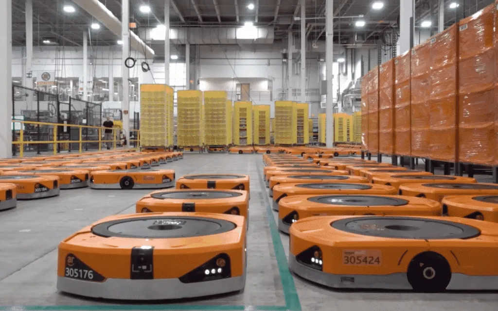 Autonomous warehouse robots coordinating inventory movement using decentralized AI principles.